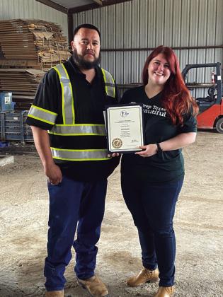 Zoe Killion, KTR Program Manager, presenting Certificate of Recognition to Juan Montoya, City of San Saba Recycling Center Supervisor