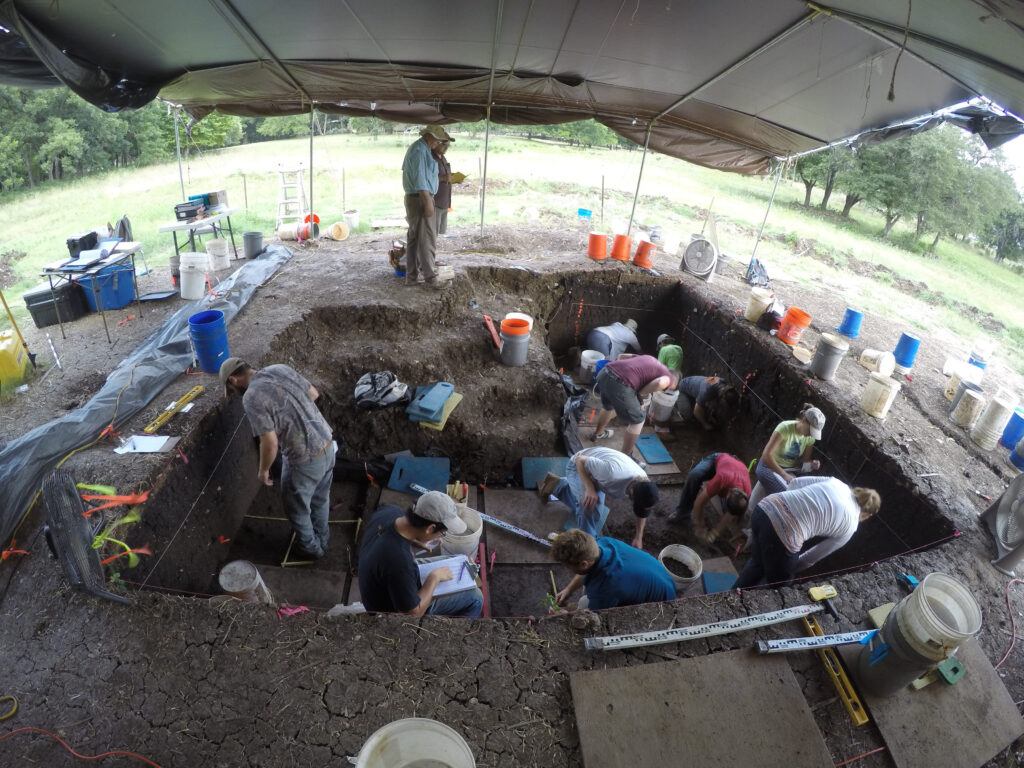 Waters and Texas A&M students on a dig at the Debra L. Friedkin site in central Texas, the oldest archaeological site in Texas and one of the oldest in North America where they found evidence of the earliest Texans. “People arrived at the site and found water, raw materials to make tools and excellent habitats for hunting,” Waters explains. “People came back and camped at the site all through time and left their tools. Thus, we have a complete sequence from 15,500 to the historic time period.” Courtesy of Michael Waters