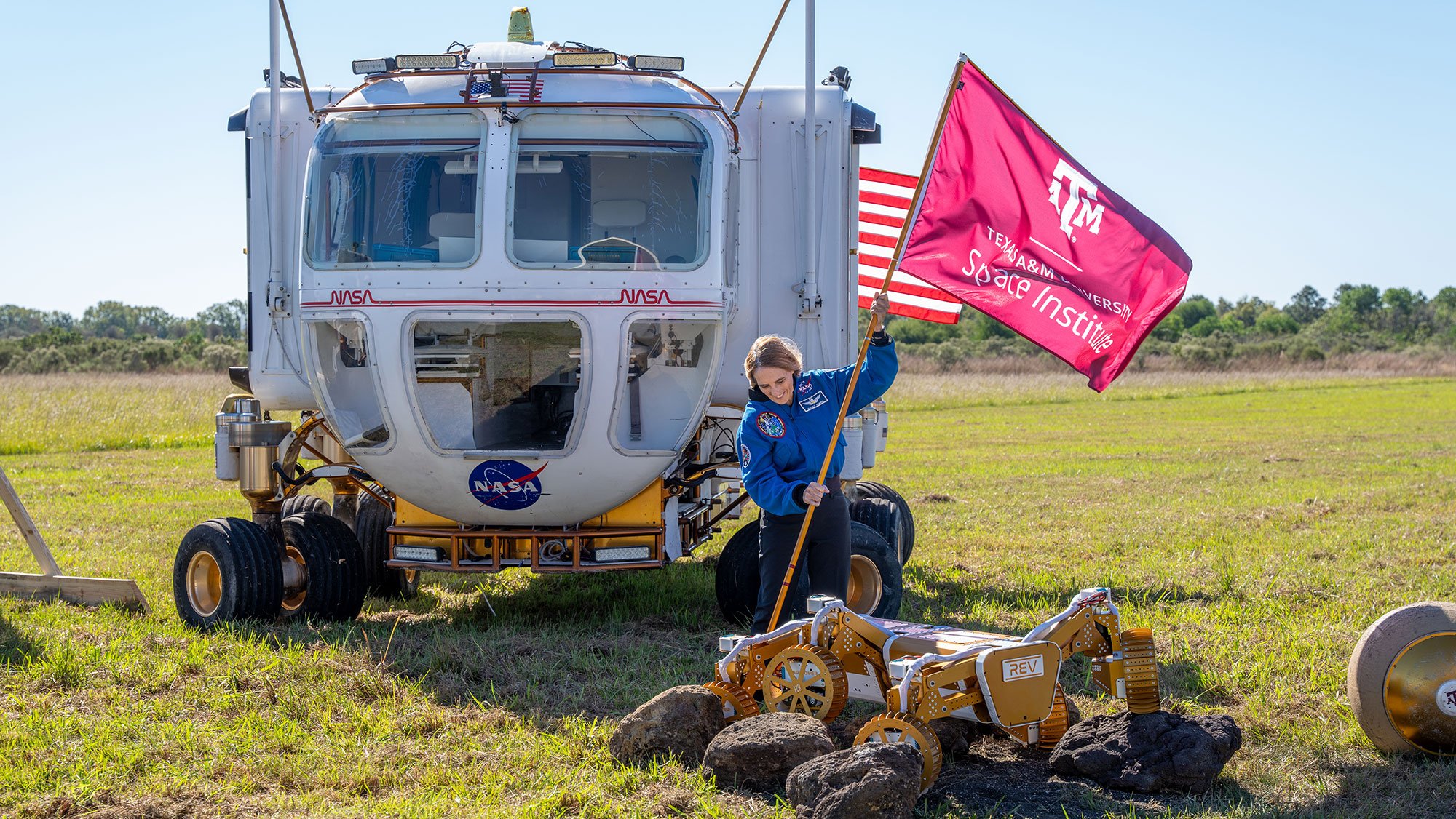 Texas A&M Professor Dr. Nancy Currie-Gregg plants a flag for the new Texas A&M University Space Institute during a groundbreaking ceremony last fall. The facility in Houston is set for completion in fall 2026.  Credit: Texas A&M University Engineering