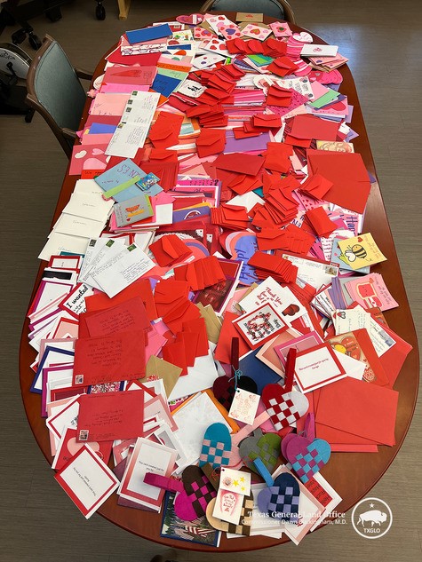 School children display their Valentines for Vets cards