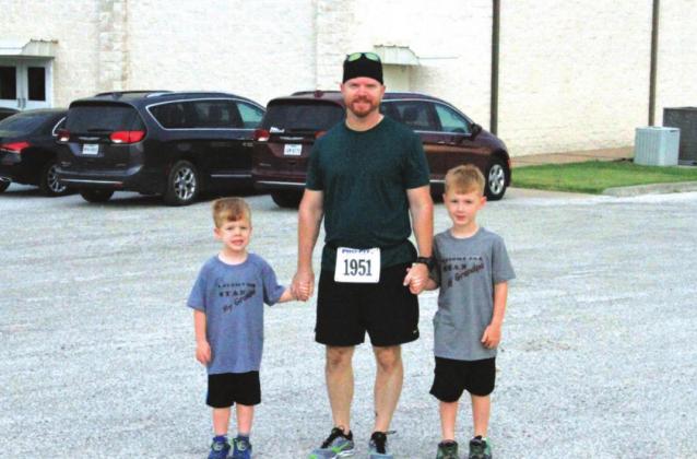 A happy father and his sons after the “Fun Run”