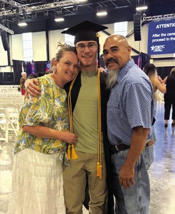 Gunner and his proud parents, Vickie and Robert