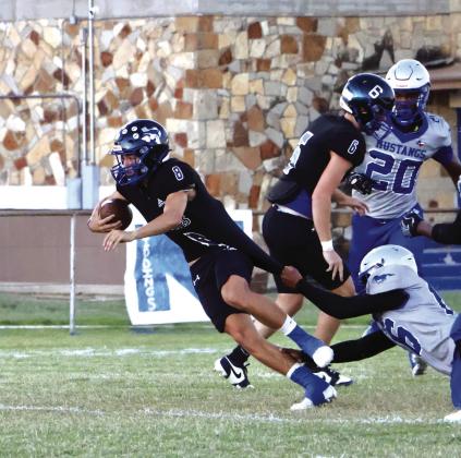 Ethan Deeds (#8) showing strength and determination in the face of great opposition / Courtesy of Sarah Locker