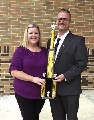 Band Directors:  Chans and Misty Moellendorf holding the Outstanding Performance Award Courtesy of Chans Moellendorf