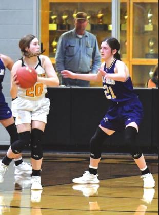 Shown at left is San Saba High School girls varsity basketball senior forward Landri Glover (20) defending an opposing player in the paint on Tuesday, January 18th, during the Lady Dillos' 45-33 victory at Goldthwaite High School. (Photo by Rita Boultinghouse)