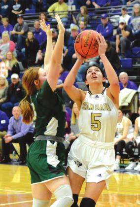 San Saba High School girls varsity basketball senior forward Nojemi Martinez (5) attempts to score in the paint on Saturday, February 26, during the Lady Dillos' dominant 61-21 victory over Normangee High School. (Photo by Rita Boultinghouse)