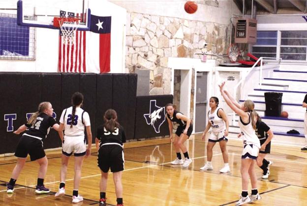 RSJH Lady Coyotes #23 Macy Mask and #2 Ayleen Aviles are seen here with #15 Kaylee Salas who is looking to score two more for her team as they run away from their competition. Courtesy of Richland Springs Coyote Booster Club