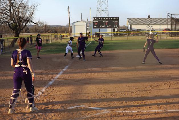 #13 3rd base Azerleigh Cummmings and #10 Zoey Turner Along with #4 Catcher Baya Baskin work the base runner.