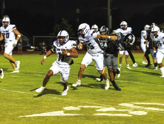 #55 Jose Vega blocks for #11 Melvin Umble. Umble had 75 yards and 2 TD.