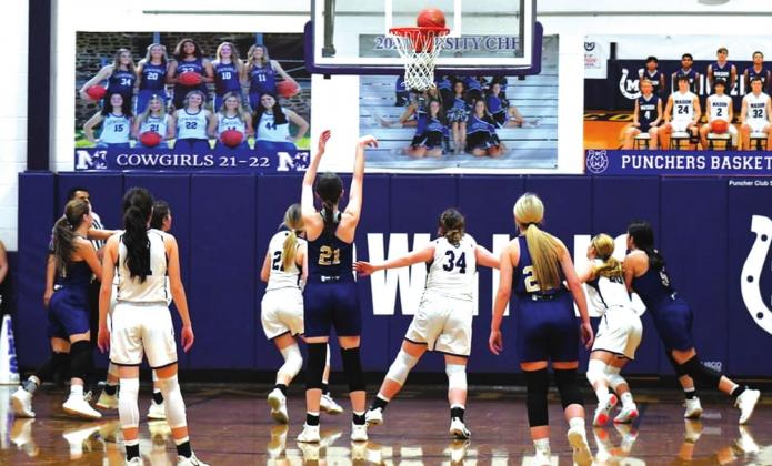 San Saba High School girls varsity basketball senior forward Landri Glover (21) knocks down a free-throw attempt on Friday, January 14, during the Lady Dillos’ 54-41 road loss at district rival Mason High School. (Photo by Rita Boultinghouse)