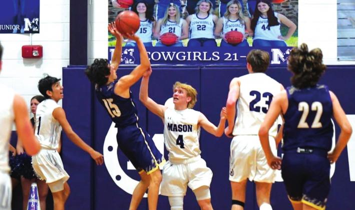 San Saba High School boys varsity basketball senior guard Reagan Mejia (15) shoots a contested fadeaway jumper on Friday, January 14, during the Dillos' 43-39 road victory at district rival Mason High School. (Photo by Rita Boultinghouse)