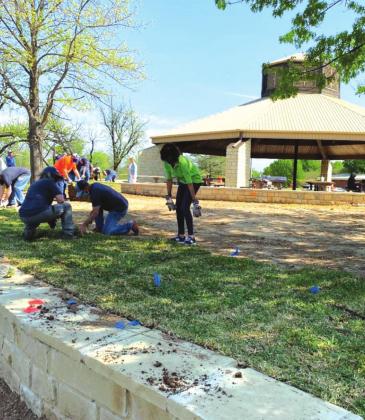 On April 9, LCRA volunteers join the City of San Saba and KSSB to plant approximately 13 pallets of sod around the retaining wall at the Gazebo in Mill Pond Park.