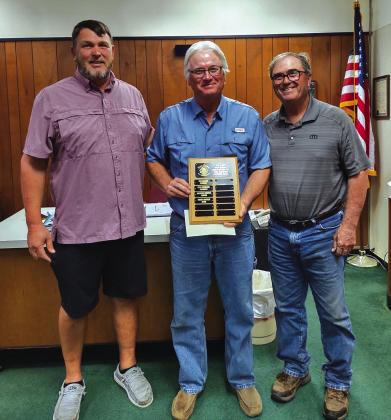 Buddy Whitley was chosen as Employee of the Month for April of 2024. Buddy's name was engraved on an Employee of the Month plaque, and he was awarded a gift certificate to a local restaurant. Participating in the award presentation are Parks Supervisor Eugene Bessent (on Buddy's right) and Mayor Pro-Tem Robert Whitten.