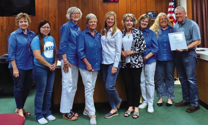 Mayor Jordan (on the right) presents award to KSSB Members (l-r):  Debbie Shahan, Lucia Martinez, Rhonda Killion, Gale Ivy, Cissy Williams, Kathleen Hawkins, Marci Butler, and Sandra Vaughn.