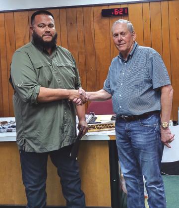 Mayor Jordan (right) presents the Certificate of Recognition for Outstanding Recycling Efforts in 2023 award to Sanitation Supervisor Juan Montoya (left) and the City of San Saba.