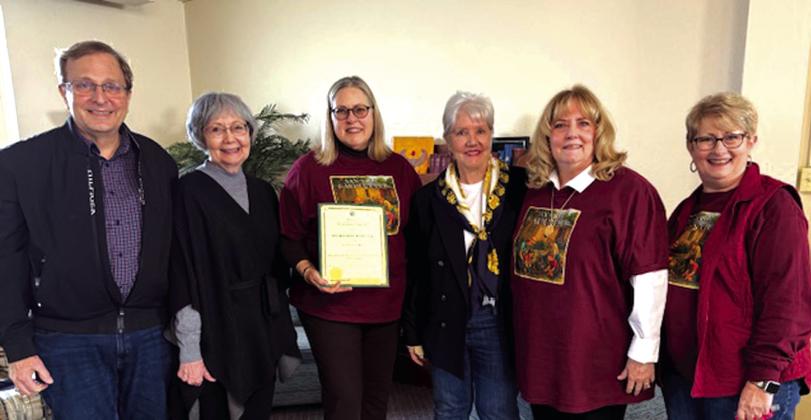 Pictured in this presentation photo are Scott Kroeger, Claire Kroeger, Cindy Sloan, Denise Hilburn, Marjean Alexander, and Trudy Hughes. Courtesy of Cynthia Sloan