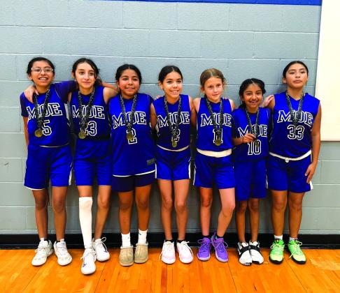 MOE Basketball traveled to Georgetown, Texas on December 7 to take part in the 2025 Hot Hoops Winter Blast basketball tournament. MOE had wins over the Lady Unbreakable 21-15, Lake Travis Knights 49-11, and Gym Snap 35-2 to win the tournament. Team members are, left to right: Aliyah Davila, Jazmin Reyes, Evelyn Macedo, Victoria Davis, Emma Kate Kuehl, Abigail Davila, and Carla Jimenez.