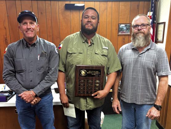 Juan Montoya, Sanitation Supervisor, was selected as Supervisor of the Third Quarter. Public Works Director Scott Glaze (left) and Alderman Michael Nelson (right) presented Juan with a plaque with his name on it and a gift certificate to a local restaurant at the September 8th City Council meeting. Photo submitted by Sabrina Maultsby