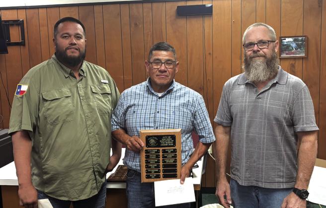 Alonzo Jimenez works in the Sanitation Department, and he was selected as the Employee of the Month for September. Alonzo's supervisor Juan Montoya (left) and Alderman Michael Nelson (right) presented Alonzo with a plaque with his name on it and a gift certificate to a local restaurant at the September 8th City Council meeting. Photo submitted by Sabrina Maultsby