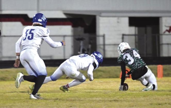 Joel Valdez going in for the tackle with Joey Bond right behind last week in the win against the Blackwell Hornets. Photo by Rita Boultinghouse