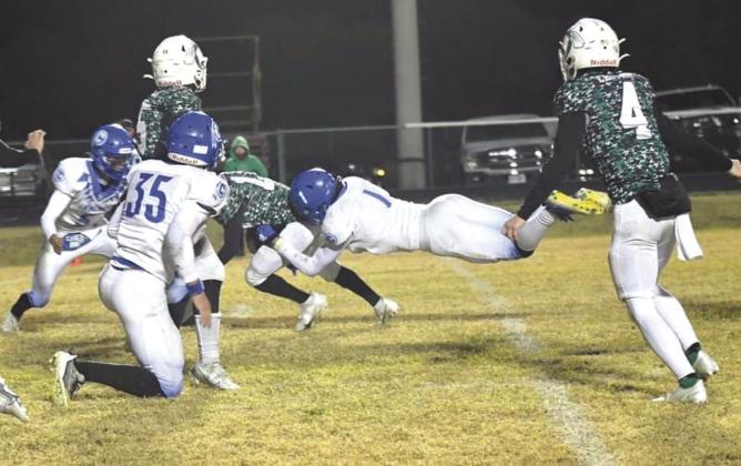 Rode Ligon with the tackle in the win against the Hornets. Photo by Rita Boultinghouse