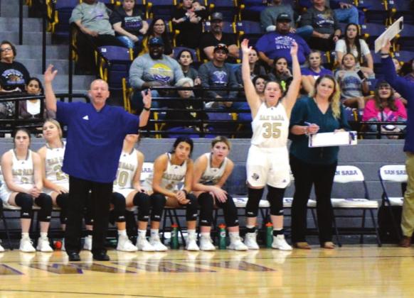 San Saba High School girls varsity basketball first-year head coach Chris Jost (left) and senior center Karlee Reed (35) celebrate on Tuesday, December 14, during the Lady Dillos’ 48-27 victory at home vs. rival Goldthwaite High School. (Photo by Rita Boultinghouse)