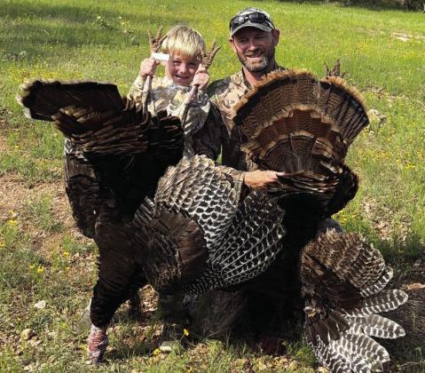 Dedmon Broyles, 6, of Cherokee, scores first turkey while hunting with Dad, Colt Broyles, at his grandparents’ San Saba County ranch (Susan and Marcus Koenig); Dad not to be outdone, also doubles up with a double-bearded gobbler. Courtesy of Callie Broyles