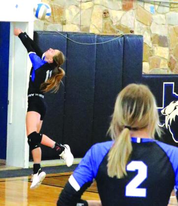 #11 Rylie Eckert reaching for the ball in the series win against Lometa on October 2nd