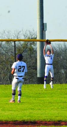 Ethan Gonzales (#8) catches a fly ball in the outfield.