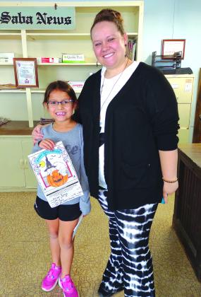 Coloring Contest 6-8 winner Allison Rivera is proudly holding her first place winning color page. Allison is pictured with her mother, Amanda Rivera.
