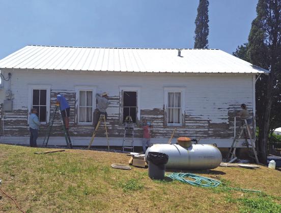 Eric Swartzell, Doug Messer, Anthony Henniger, Jennifer Swartzell, and Brandie Henniger are hard at work on the Bend Church of Christ building getting it ready to paint! Courtesy of Brandie from the Bend