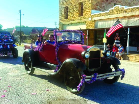 Galen Guillory managed to restore his old Ford in time to give Kendra and Lucas Oldham a ride. Courtesy of Paige Moats