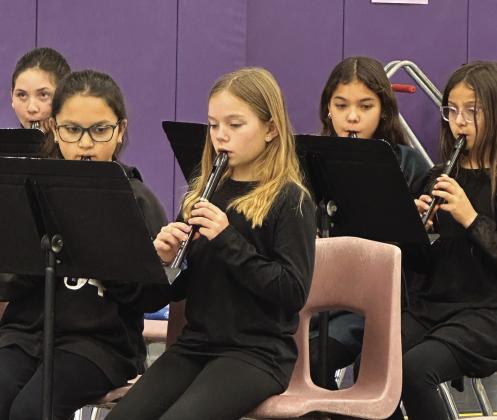 Front row - Daniella Salinas and Clara Murray, back row - Ava Spence, Evelyn Macedo, and Allison Rivera playing recorder at last week’s concert. Courtesy of Courtney Keuhl