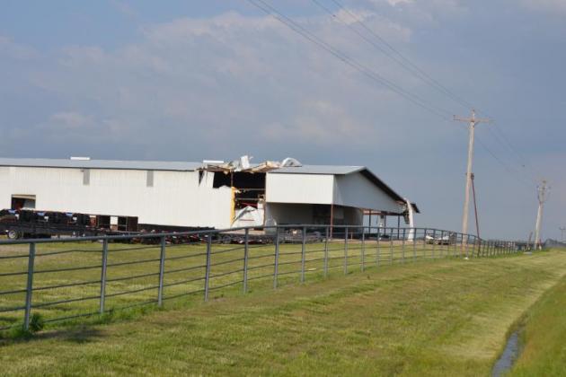 J &amp; I received quite a bit of damage after the tornado touched down on top of the building. Photo by Matt Caban