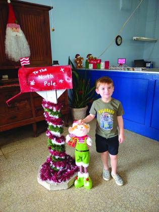 Carter Jacobs mailing his letter to Santa!