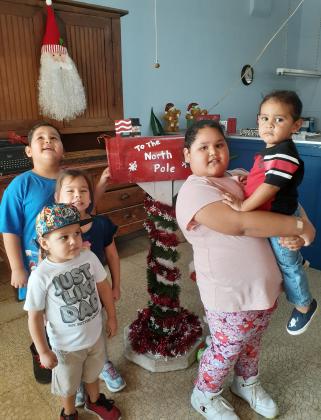 The Vasquez children bringing their letters to Santa!