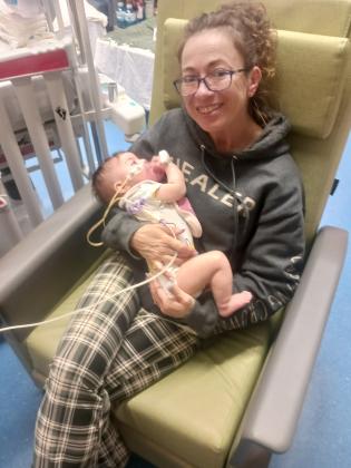 Brandie Harris in hog heaven with Baby Blake