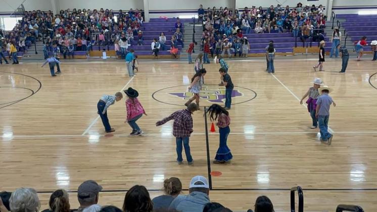 2nd grade students square dancing