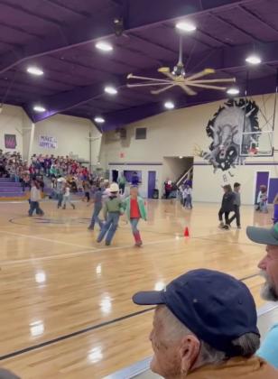 1st grade students performing a square dance
