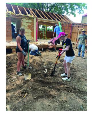 Austin and Ellie digging a hole