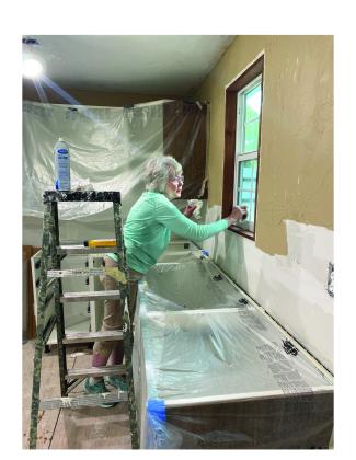 Debbie Millican cleaning windows