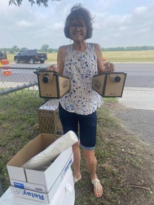 Martha Leigh Whitten brings coffee donated by Alamo Pecan to the volunteers