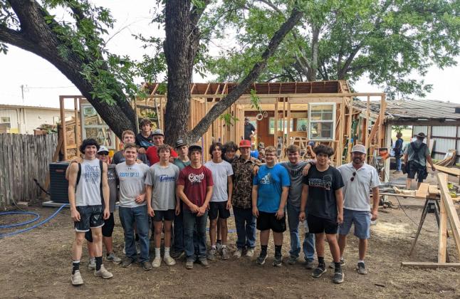 Richland Springs take a break from their hard work to post for a group picture.