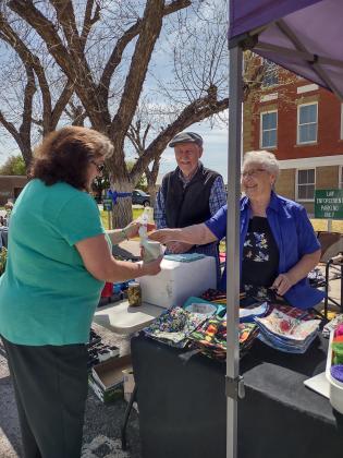 Don and Joan Van Gorp making a sale at the Pecan Capital Trade Day