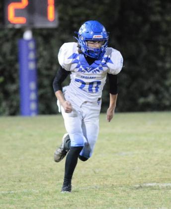 Senior James Beck running the field in the bi-district championship game against Zephyr - photo by Rita Boultinghouse