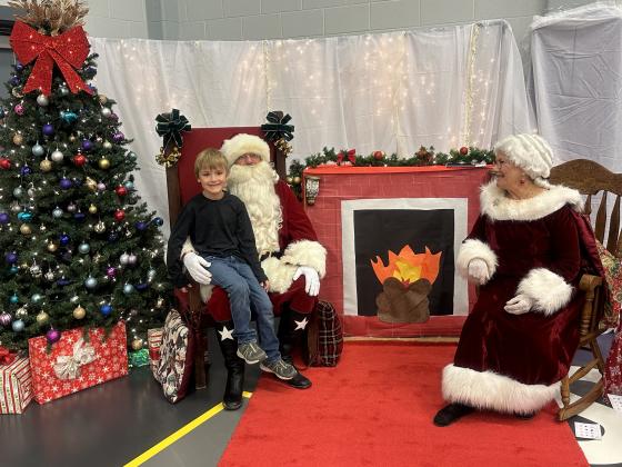 Dayler Barrier, SSES 2nd Grader, is all smiles because he shared his Christmas wish with Santa and Mrs. Claus.