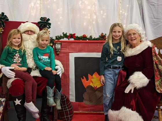 Santa and Mrs. Claus are so lucky to have not one, not two, but three beautiful blondes visiting them. Abby, Lily, and Hadley Fuller are excited to share their Christmas wishes with them.