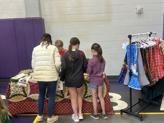 Charlotte Spence, SSES parent, sharing some of her hand-sewn items with some customers