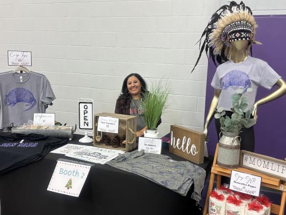 Megan Cisneroz selling her original designed t-shirts