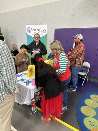 Kelli Barker with San Saba's First Baptist Church sharing some craft time with students
